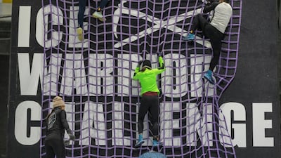 Competitors tackled a net climb.