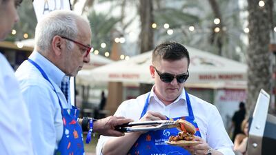 Visitors participate in the Waterfront Market BBQ School workshop