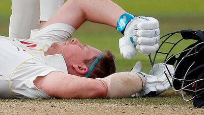 Australia's Steve Smith lays on the pitch after being hit in the head by a ball off the bowling of England's Jofra Archer during play on the fourth day of the second Ashes Test at Lord's. AFP