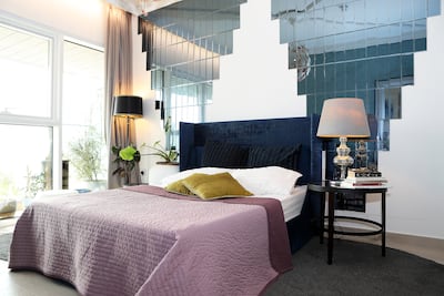 Mr Rangel's revamp included installing mirror cladding in the bedroom, new light fixtures and a bar in the kitchen. Pawan Singh / The National