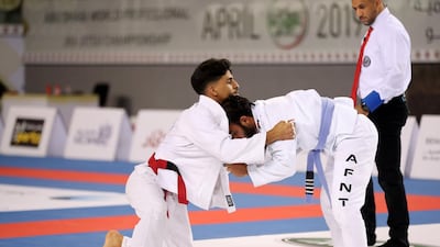 Khalifa Nassrati, left, in action during the inaugural Vice President's Cup Round-1 at Al Jazira Club. Chris Whiteoak / The National