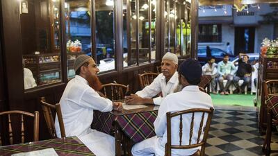 Customers wait for orders at Cafe Irani Chai in Mumbai. India has long been dominated by unbranded eateries, mainly serving North Indian and South Indian food. Subhash Sharma for The National