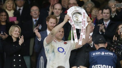 England’s Dylan Hartley celebrates with the Triple Crown at the end of the match. Action Images via Reuters / Henry Browne