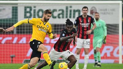 Udinese's Spanish forward Fernando Llorente challenges AC Milan's Ivorian midfielder Franck Kessie. AFP