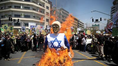 Iranians burn an effigy in the likeness of U.S. President Donald Trump during a protest marking the annual Al Quds Day (Jerusalem Day) on the last Friday of the holy month of Ramadan in Tehran, Iran June 8, 2018. Tasnim News Agency / via Reuters