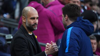 Manchester City manager Pep Guardiola, left, and Tottenham counterpart Mauricio Pochettino shake hands ahead of kick-off. Shaun Botterill / Getty Images
