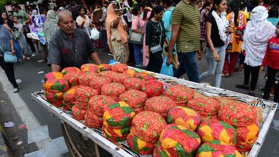 A vendor sells decorative traditional turbans along a street ahead of the Navratri festival in Ahmedabad. AFP