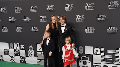Real Madrid and Croatian midfielder Luka Modric, his wife Vanja Bosnic and their children Ivano and Emma arrive for the awards in London. EPA