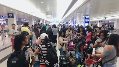A total of 105 Filipino nationals prepare to fly out of Dubai to Manila as part of the UAE's amnesty programme. Reem Mohammed / The National