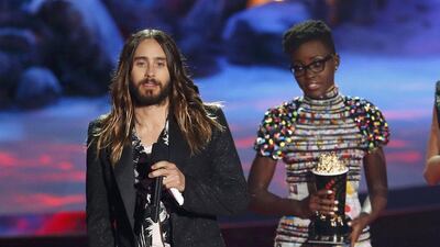 Jared Leto accepts the award for best on screen transformation from Actress Lupita Nyong'o, right, at the 2014 MTV Movie Awards in Los Angeles, California on April 13, 2014. Lucy Nicholson / Reuters