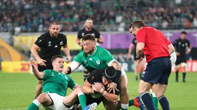 Matt Todd of New Zealand scores his team's fifth try past Andrew Porter (R) and Johnny Sexton of Ireland during the Rugby World Cup 2019 Quarter Final match between New Zealand and Ireland at the Tokyo Stadium in Chofu, Tokyo, Japan. Getty Images