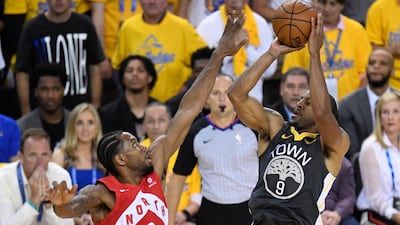Golden State Warriors forward Andre Iguodala (9) shoots over Toronto Raptors forward Kawhi Leonard. AP Photo