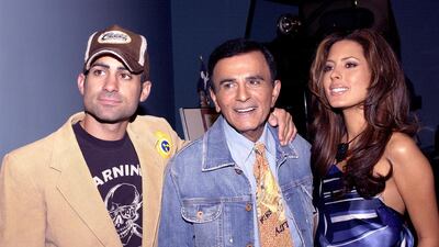The late voice actor Casey Kasem, centre, with his son Mike and daughter Kerri in 2005. Amanda Edwards / Getty Images