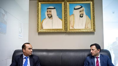 Anil Wadhwani, the head of consumer banking at Citibank for Europe, the Middle East and Africa, left, and Dinesh Sharma, Citi’s head of consumer banking for the Middle East and Africa, say most of the bank's transactions are done outside the branch. Delores Johnson / The National