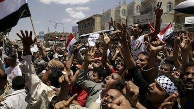 Anti-government protesters shout slogans during a rally to demand the ouster of Yemen's President Ali Abdullah Saleh outside Sanaa University April 6, 2011. Tens of thousands of people pressed opposition demands on Wednesday for Saleh to resign, a standoff Gulf Arab ambassadors hope to help resolve at talks in neighbouring Saudi Arabia. REUTERS/Ammar Awad (YEMEN - Tags: POLITICS CIVIL UNREST) *** Local Caption *** AWA03_YEMEN-_0406_11.JPG