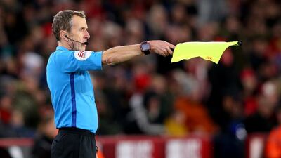 Linesman Derek Eaton is overruled by VAR during the match. getty