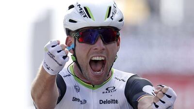 Team Dimension Data rider Mark Cavendish celebrates after winning the first stage of the 103rd Tour de France on Saturday at Utah Beach. Yoan Valat / EPA / July 2, 2016