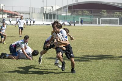 Gems World Academy Dubai during a practice match ahead of the Dubai Rugby Sevens. Matthew Pewtner, the team’s coach, said: "Ninety per cent of our players had never even touched a rugby ball before, let alone played a competitive game. The improvement they have made has been immeasurable." Antonie Robertson / The National