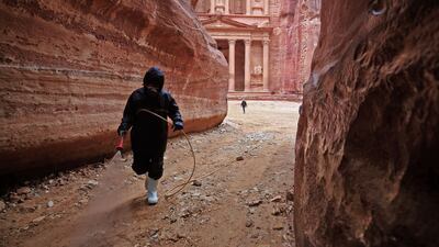 A labourer sprays disinfectant in Jordan's Petra south of the capital Amman to prevent the spread of coronavirus. AFP