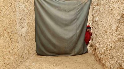 A child waits to receive a polio vaccination during an anti-polio campaign on the outskirts of Jalalabad, Afghanistan. Parwiz / Reuters