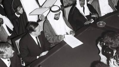 The signing at Union House in Dubai on December 2, 1971. Sheikh Zayed reads the Treaty of Friendship between the UAE and Britain, watched by Sir Geoffrey Arthur, who sent cables home that detailed his recollection of proceedings.