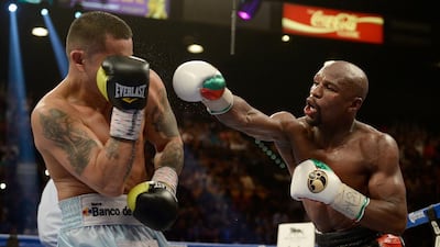 Bob Arum, the founder and chief executive of Top Rank, told The National that while Floyd Mayweather, right, is “doing a very good job of promoting his own stuff”, not every boxer is suited to the role of promoter. Harry How/AFP