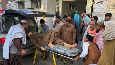 A man injured in clashes between Pakistan and Afghanistan forces is taken to a hospital in the Pakistani city of Chaman on Wednesday. AP