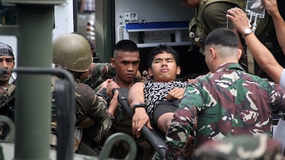 Philippine soldiers, wounded in an ongoing clash with Islamist militants from the Abu Sayyaf group, arrive at a military hospital in Jolo, Sulu province, on the southern island of Mindanao on March 3, 2017, hours prior to the arrival of President Rodrigo Duterte. - Philippine soldiers clashed anew on March 3 with Islamist militants behind the beheading of a German hostage. The Abu Sayyaf, a kidnap-for-ransom network in the southern Philippines that has declared allegiance to the Islamic State group, killed Jurgen Kantner, 70, on February 26 after its demands for 30 million pesos ($600,000) were not met. (Photo by NICKEE BUTLANGAN / AFP)