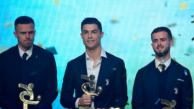 Josip Ilicic, Cristiano Ronaldo and Miralem Pjanic on stage at the Gran Gala del Calcio 2019 ceremony. AFP