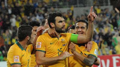 Mile Jedinak, centre, missed Australia's defeat to South Korea but is available to face China in the quarter-finals. Mal Fairclough/AFP