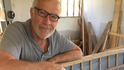 Jonathan Gornall with his almost finished boat. Jonathan Gornall