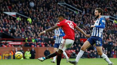 Manchester United's Marcus Rashford scores their third goal. Reuters