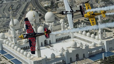 Nigel Lamb (in the yellow plane), Kirby Chambliss (in the blue plane) and Michael Goulian (in white plane) fly over the Sheikh Zayed Mosque during a recon flight on February 26, 2014 prior to the first stop of the Red Bull Air Race World Championship in Abu Dhabi. AP Photo/Joerg Mitter, Red Bull Air Race