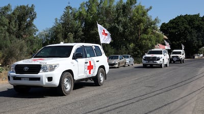 An International Committee of the Red Cross convoy heads towards Naqoura, in southern Lebanon, to pick up detainees released by Israel. EPA