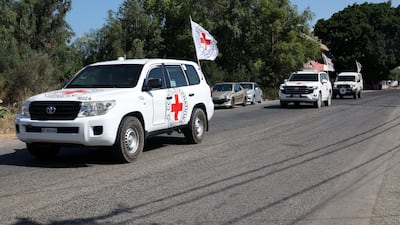 An International Committee of the Red Cross convoy heads towards Naqoura, in southern Lebanon, to pick up detainees released by Israel. EPA