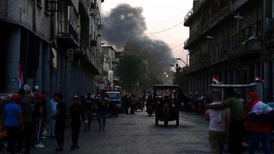 Smoke clouds rise from the site of clashes between Iraqi protesters and security forces near al-Ahrar bridge (The Freemen Bridge) in central Baghdad, Iraq. EPA
