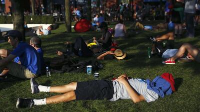 People rest in the shade at the 2014 US Open tennis tournament in New York. Shannon Stapleton / Reuters / August 26, 2014
