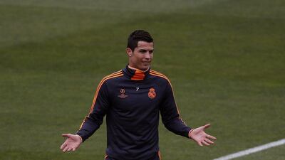 Cristiano Ronaldo laves the pitch at Real Madrid's Tuesday training session. He did not participate in full while Karim Benzema and Gareth Bale held out altogether. Sergio Perez / Reuters / May 20, 2014