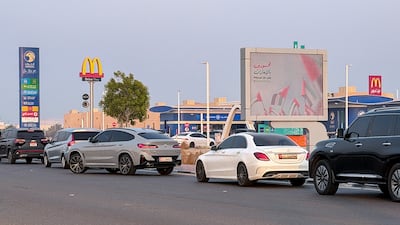 Motorists queue up at an Adnoc petrol station in Khalifa City, Abu Dhabi. Victor Besa / The National