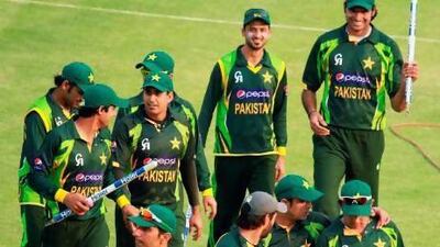 Pakistan players walk off the pitch victorious. Tsvangirayi Mukwazhi / AP Photo