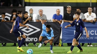 A Minerva Academy player breaks through the La Liga Academy defence.