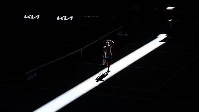 France's Adrian Mannarino looks up as the roof closes on Rod Laver Arena during a practice session in Melbourne before the Australian Open tennis championship. AFP