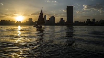 A traditional Egyptian boat known as a "Faluka" sails on the Nile River during sunset in the capital of Cairo. Khaled Desouki / AFP