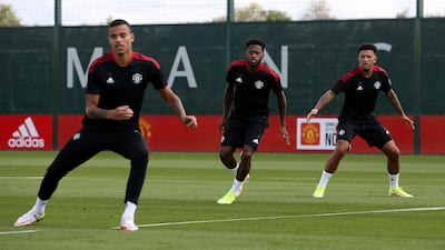 Mason Greenwood, Fred, Jadon Sancho of Manchester United in action during a first team training session at Carrington Training Ground in Manchester, England.