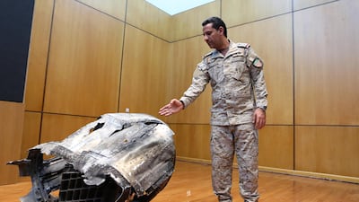 Saudi-led coalition spokesman, Colonel Turki Al Malki, displays the debris of a ballistic missile launched by Yemen's Houthi rebels towards the capital Riyadh during a news conference in Riyadh on March 29, 2020. Reuters