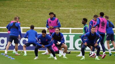 England players warm-up at training.