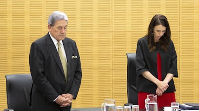 New Zealand Prime Minister Jacinda Ardern (R) and deputy Winston Peters (L) observe a minute of silence for victims of the White Island tragedy during a cabinet meeting in Wellington, New Zealand. EPA