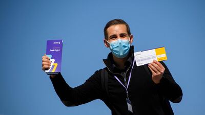Passengers on the first flight recieved a commemorative first flight boarding pass. AFP