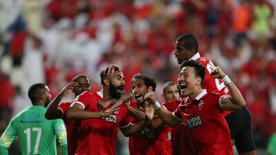 Al Ahli players celebrate the winning goal by Salmeen Khamis, third left, during the Arabian Gulf Super Cup against Al Ain at Mohammed bin Zayed Stadium in Abu Dhabi on March 27, 2015. Adi Al Naimi / Al Ittihad
