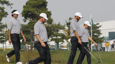 United States players, from left, Bubba Watson, JB Holmes, Dustin Johnson and Jordan Spieth walk down a fairway during their final practice round in Incheon, South Korea. Lee Jin-man / AP Photo